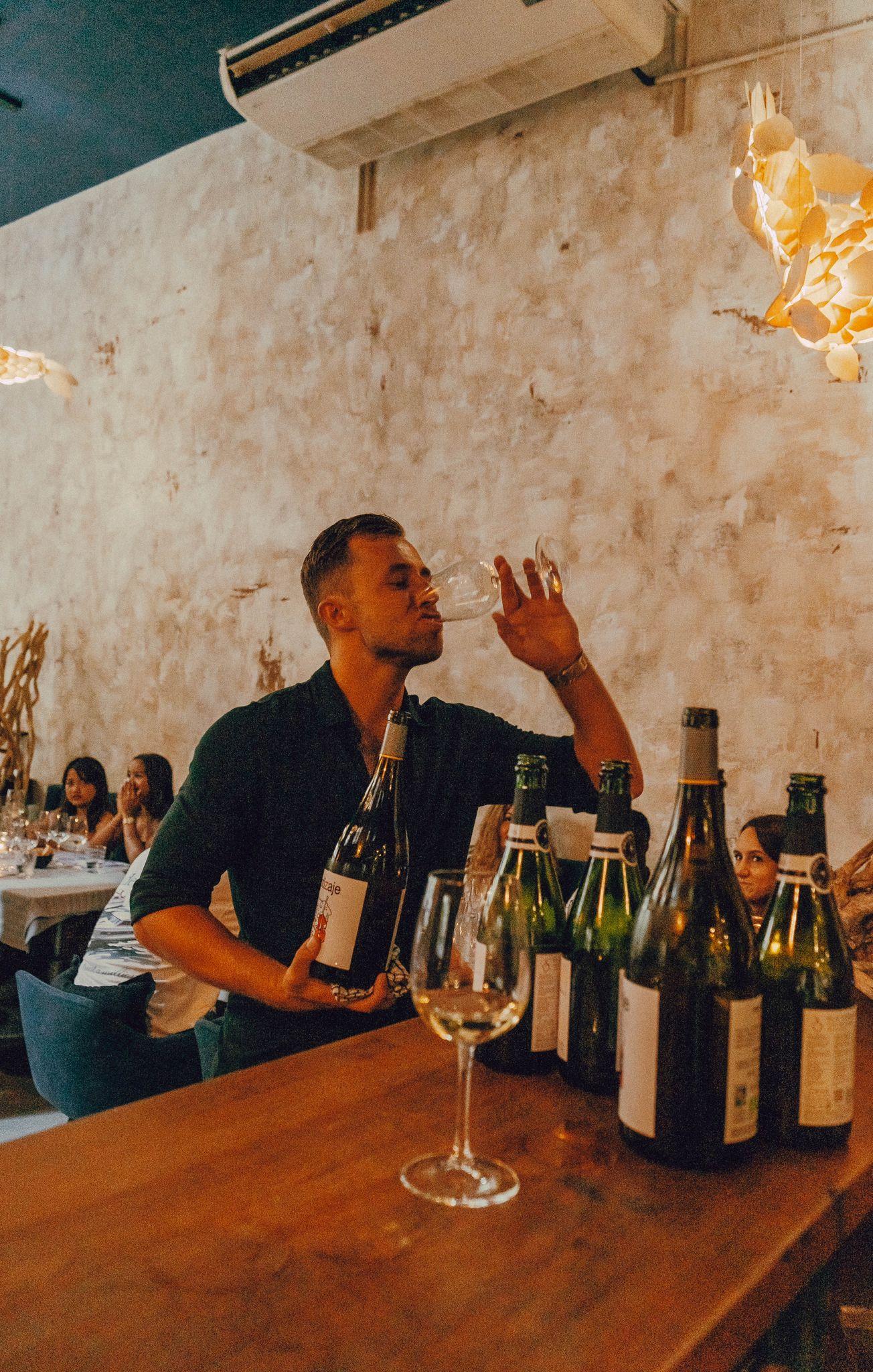 Sommelier Tristan tasting wine at the location in Valencia