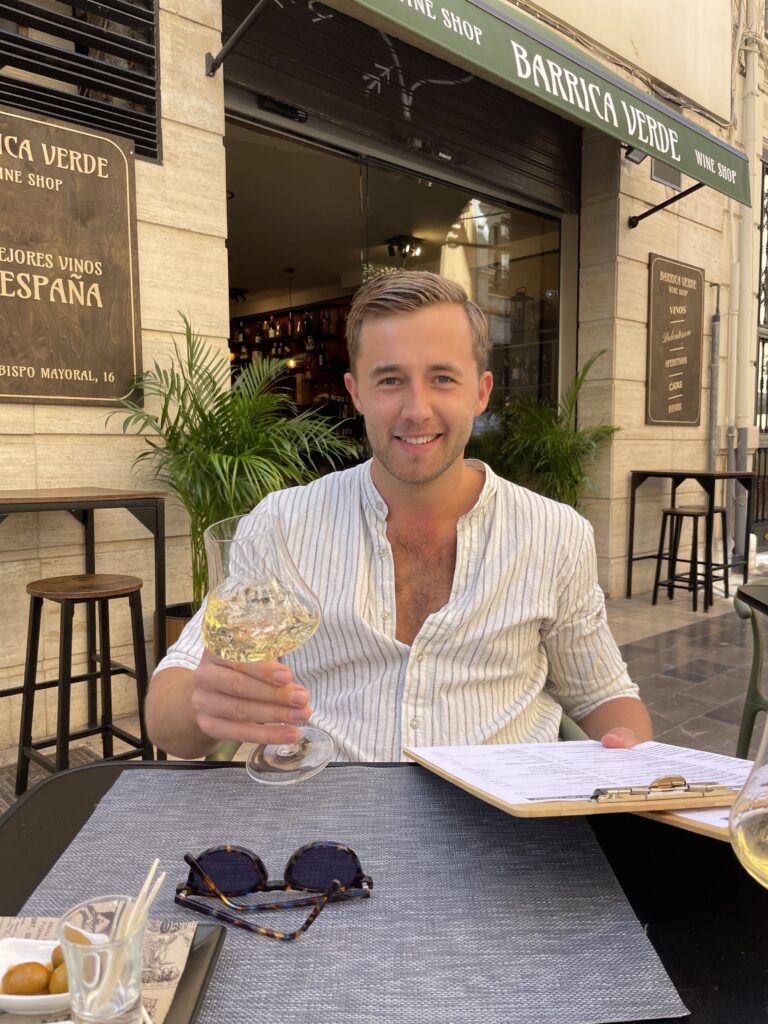 Sommelier Tristan choosing wines from the wine menu.